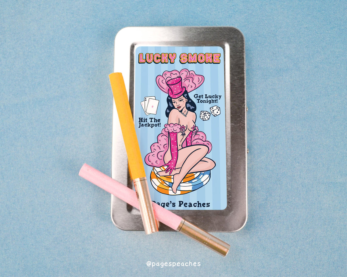 a tin with a cigarette and a pencil on it