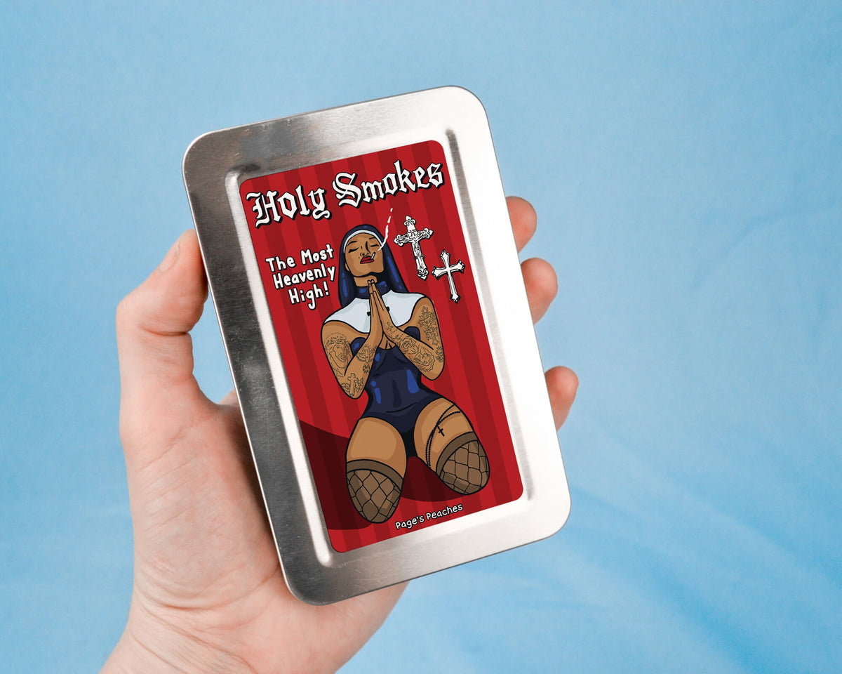 a hand holding a tin with a picture of a teddy bear on it