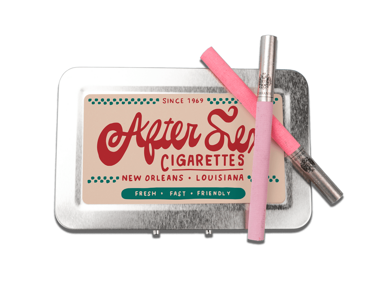 a tin of cigarettes with a pink cigarette in it