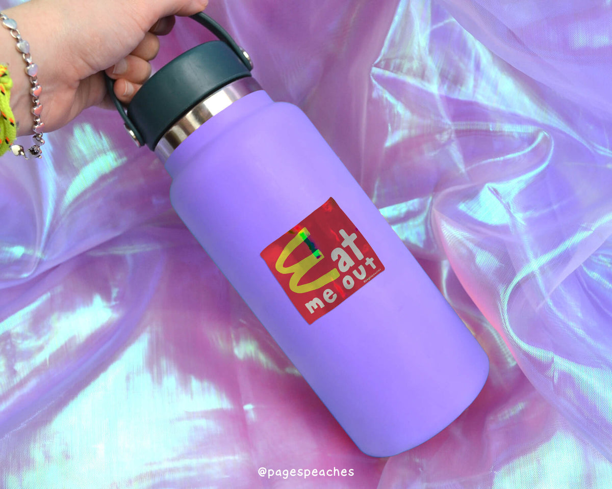 A purple water bottle with a McDonald's logo on it, held in a hand against a purple background.