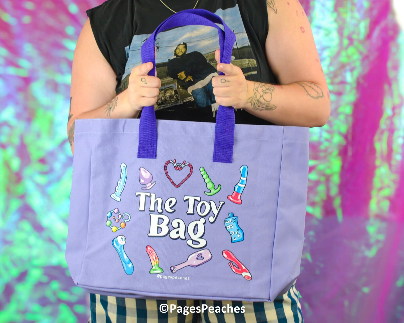 Purple tote bag with colorful illustrations and text on a white background