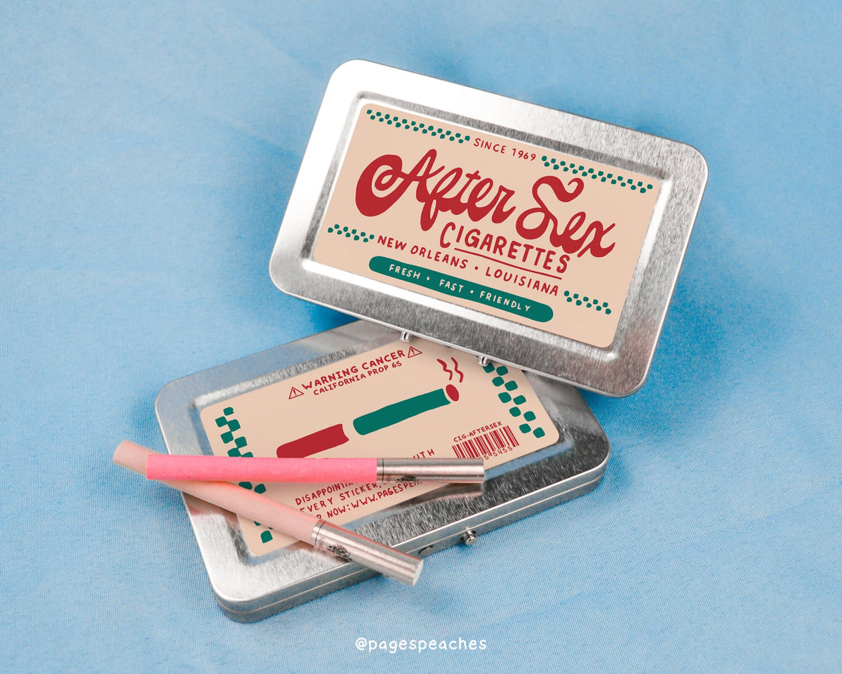 a tin of cigarettes with a pink pen in it