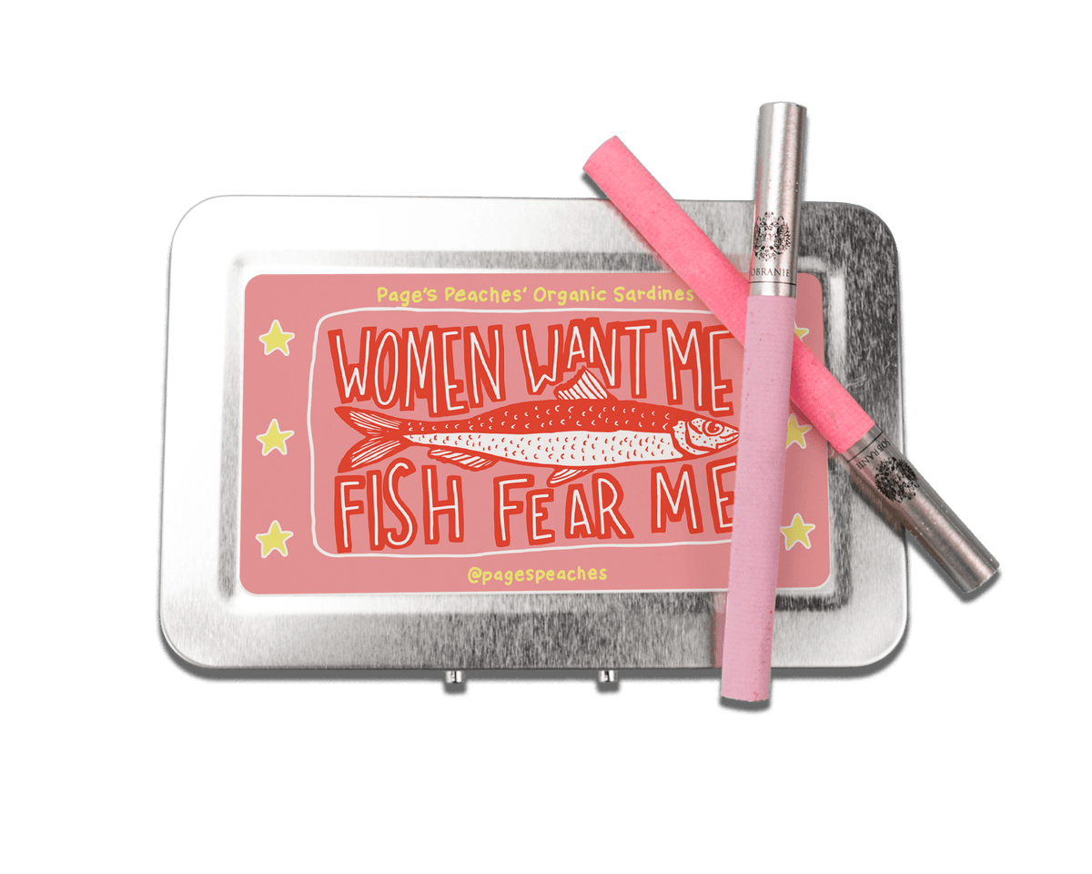 a pink pen sitting on top of a metal tray